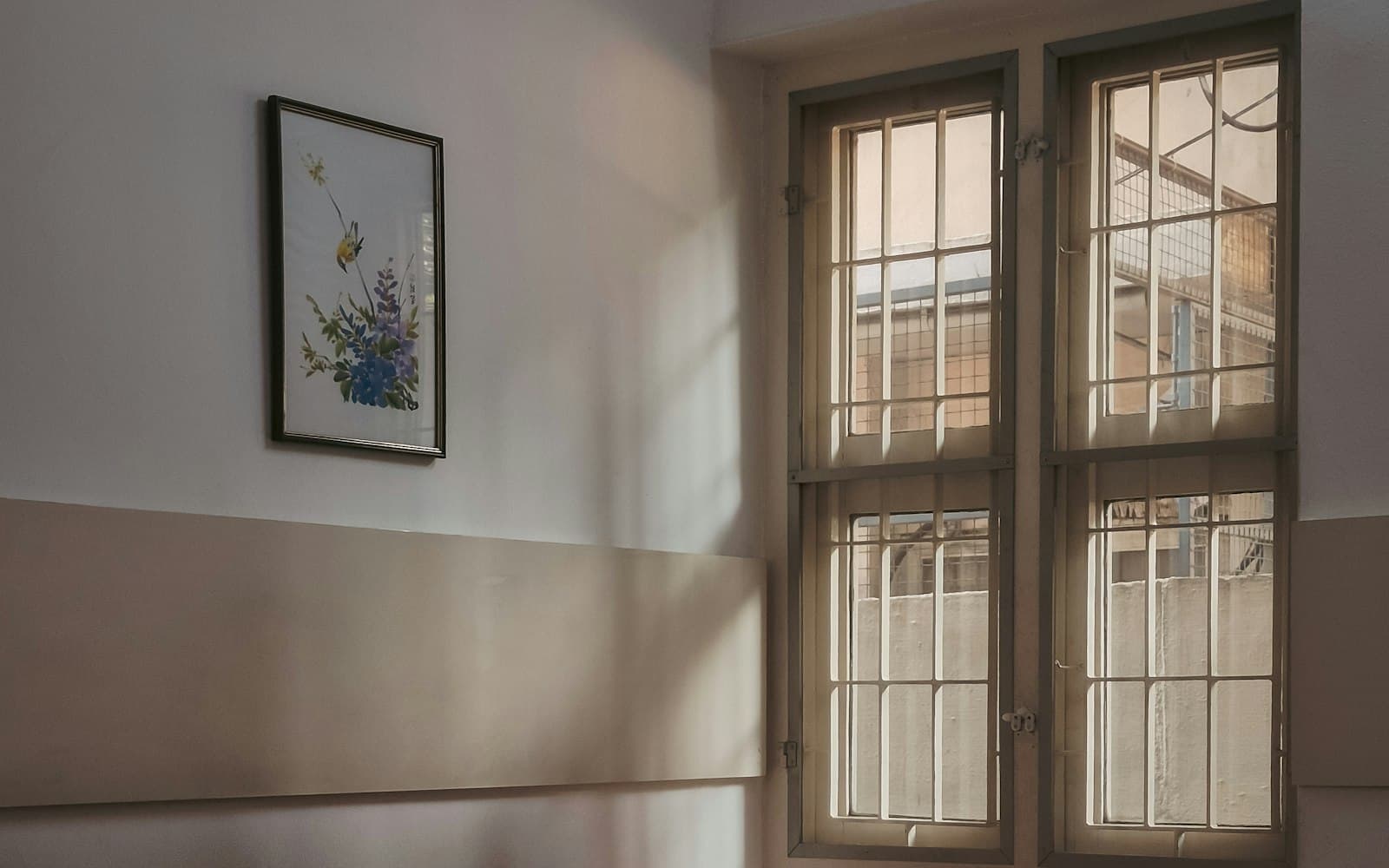 Seating along a clinic corridor beside a tall window