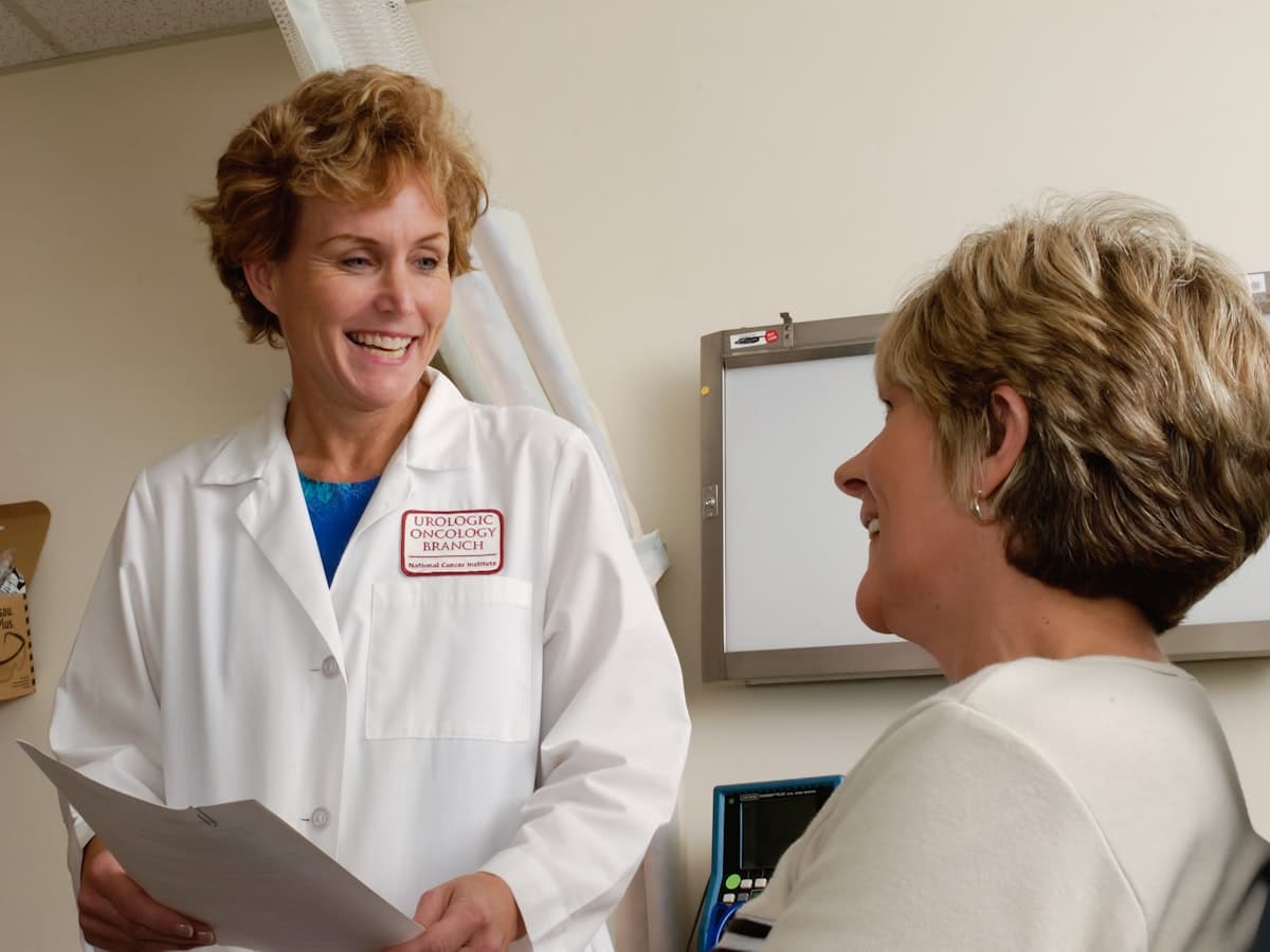 A doctor sitting and talking with a patient in a consulting room